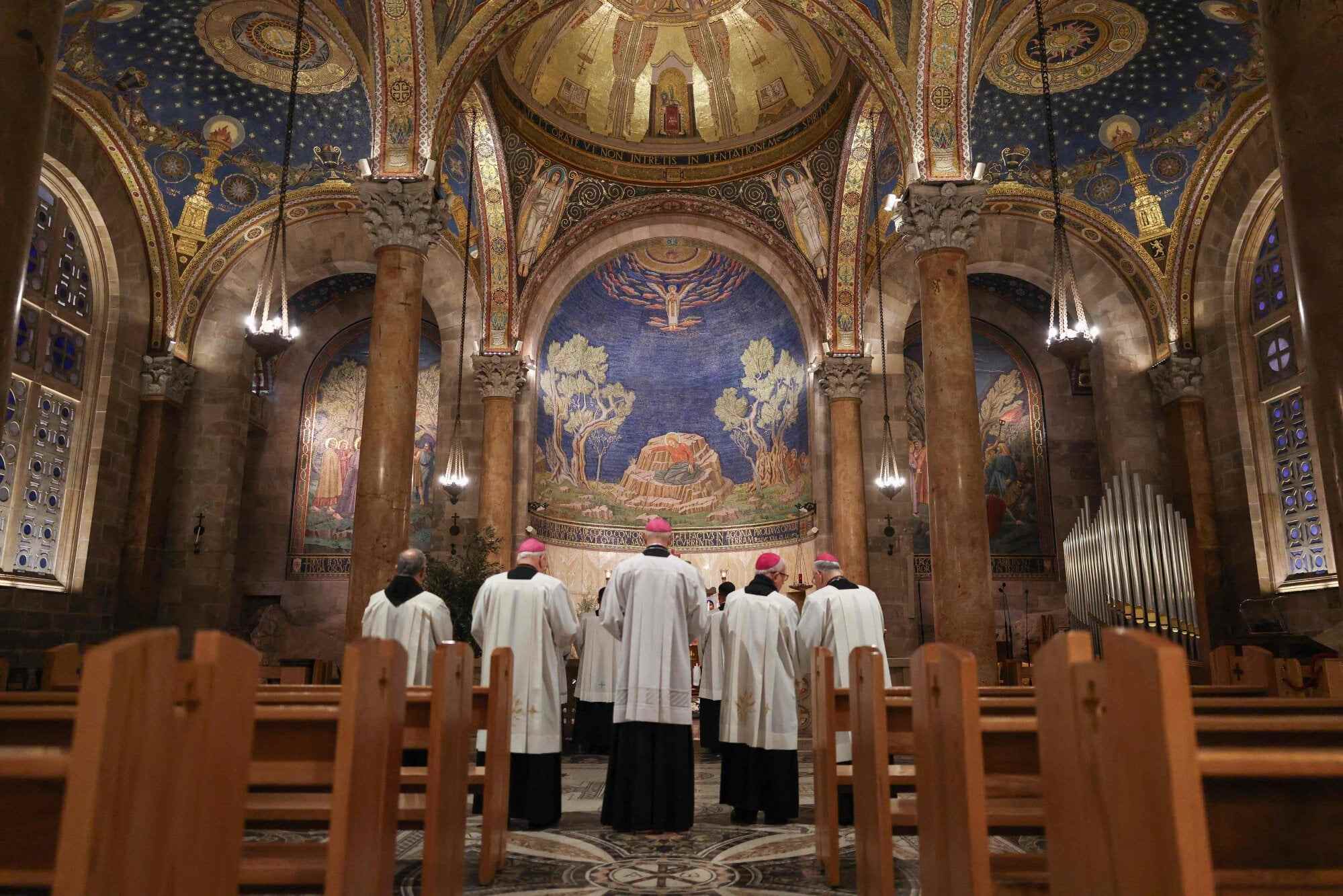 Members of the clergy attend a prayer service in the Church of All Nations following the cancellation of the traditional Palm Sunday procession from the Mount of Olives. Photo: AFP