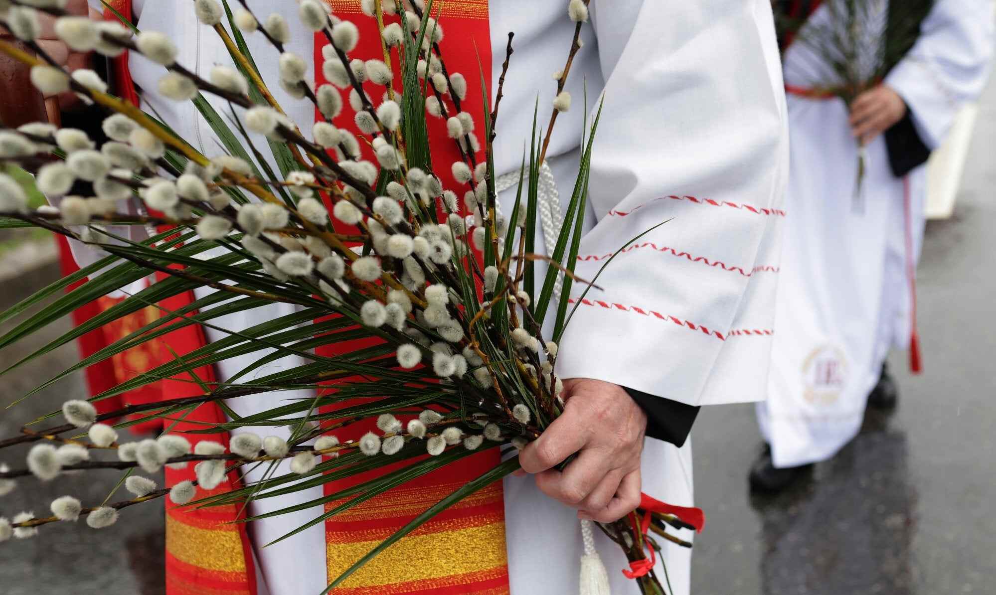 Catholic clergy participate in the Palm Sunday procession in Bucharest, Romania. Photo: EPA
