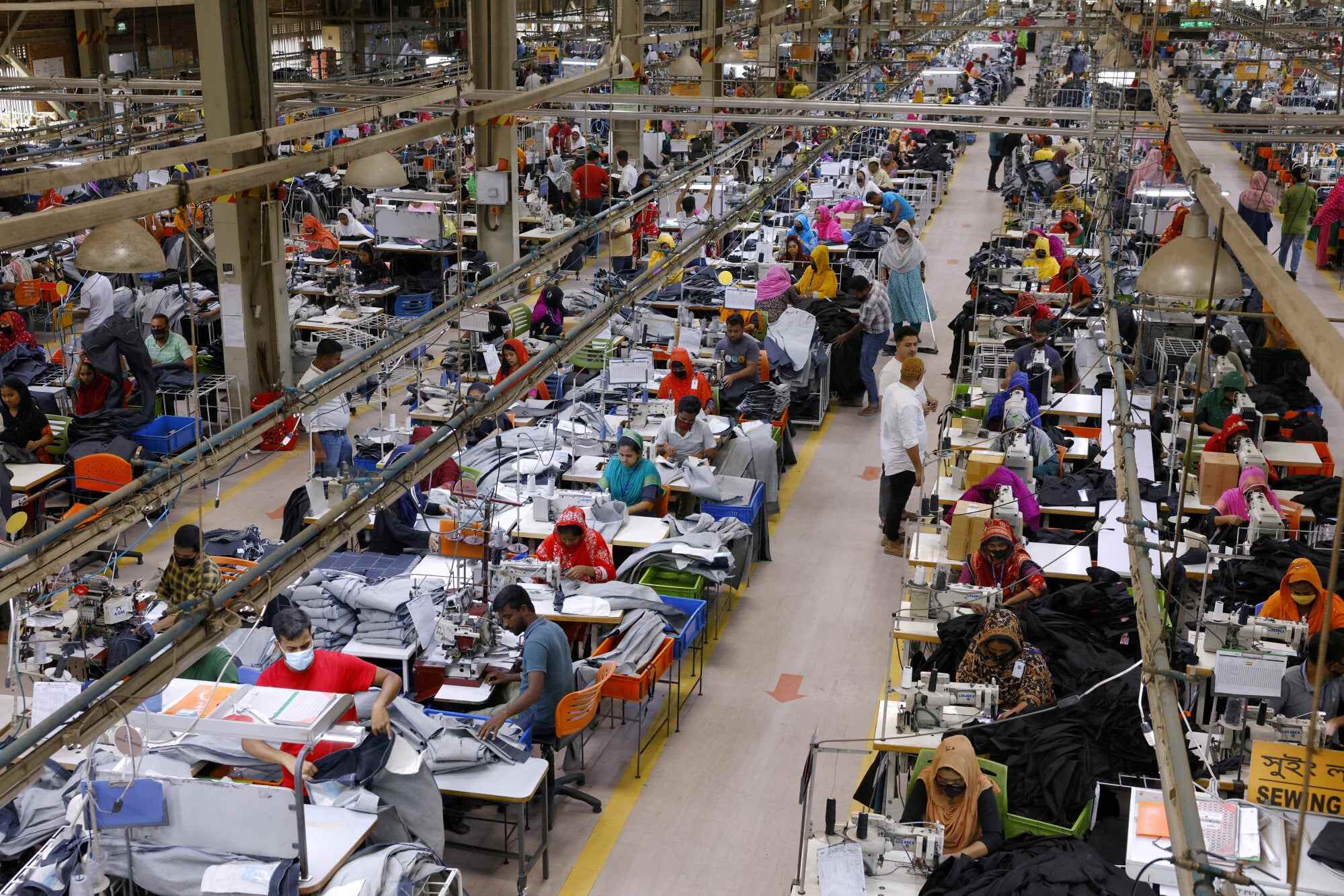 Bangladeshi garment workers make clothing in the sewing section of a factory in Gazipur, Bangladesh. Photo: Reuters