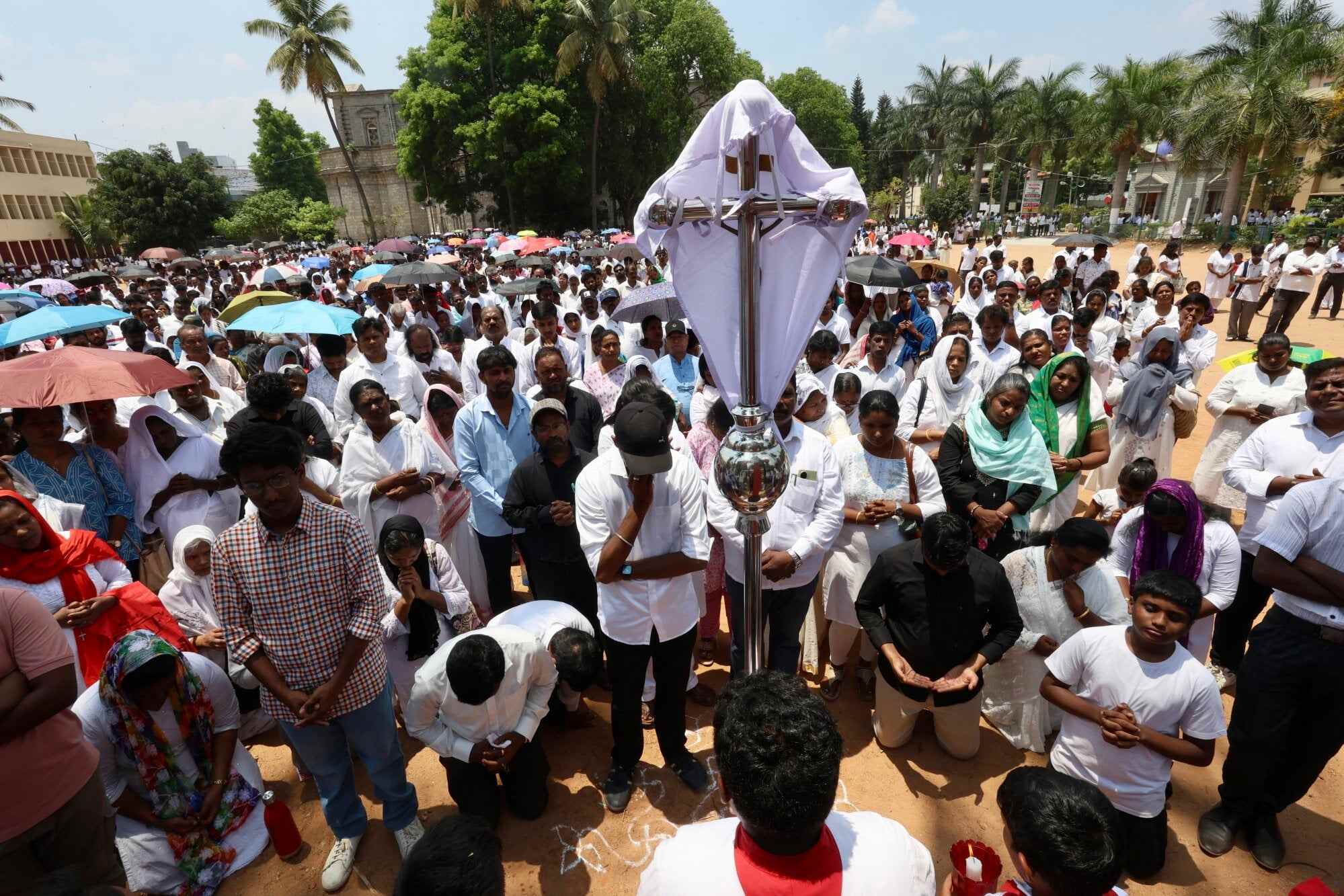 Christian devotees offer prayers during a Good Friday procession at St Francis Xavier’s Cathedral in Bengaluru, India. Photo: EPA