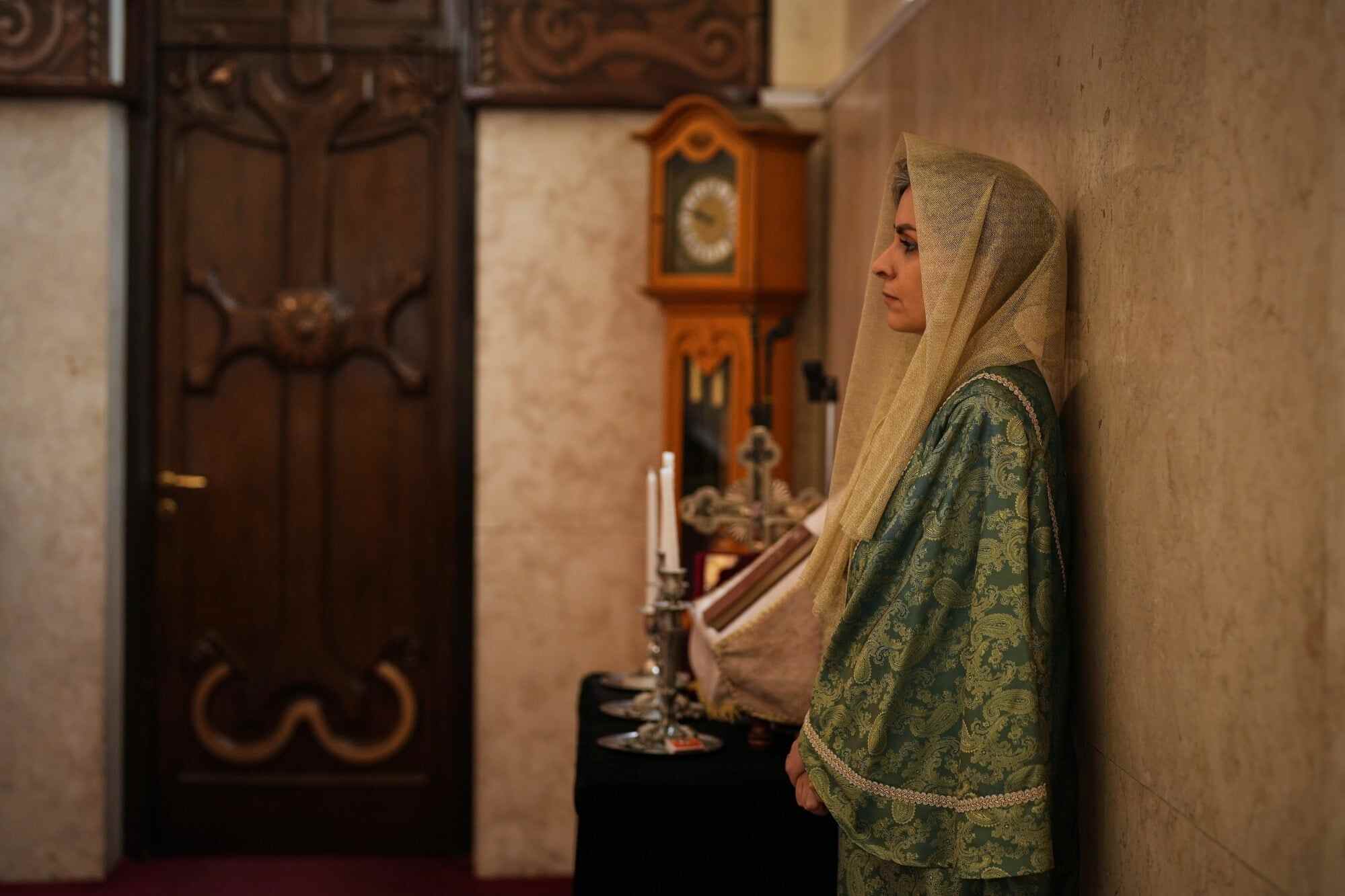 A woman leans on a wall during Easter Sunday Mass at Saint Sarkis Cathedral, an Armenian Apostolic church, in Tehran, Iran. Photo: AP