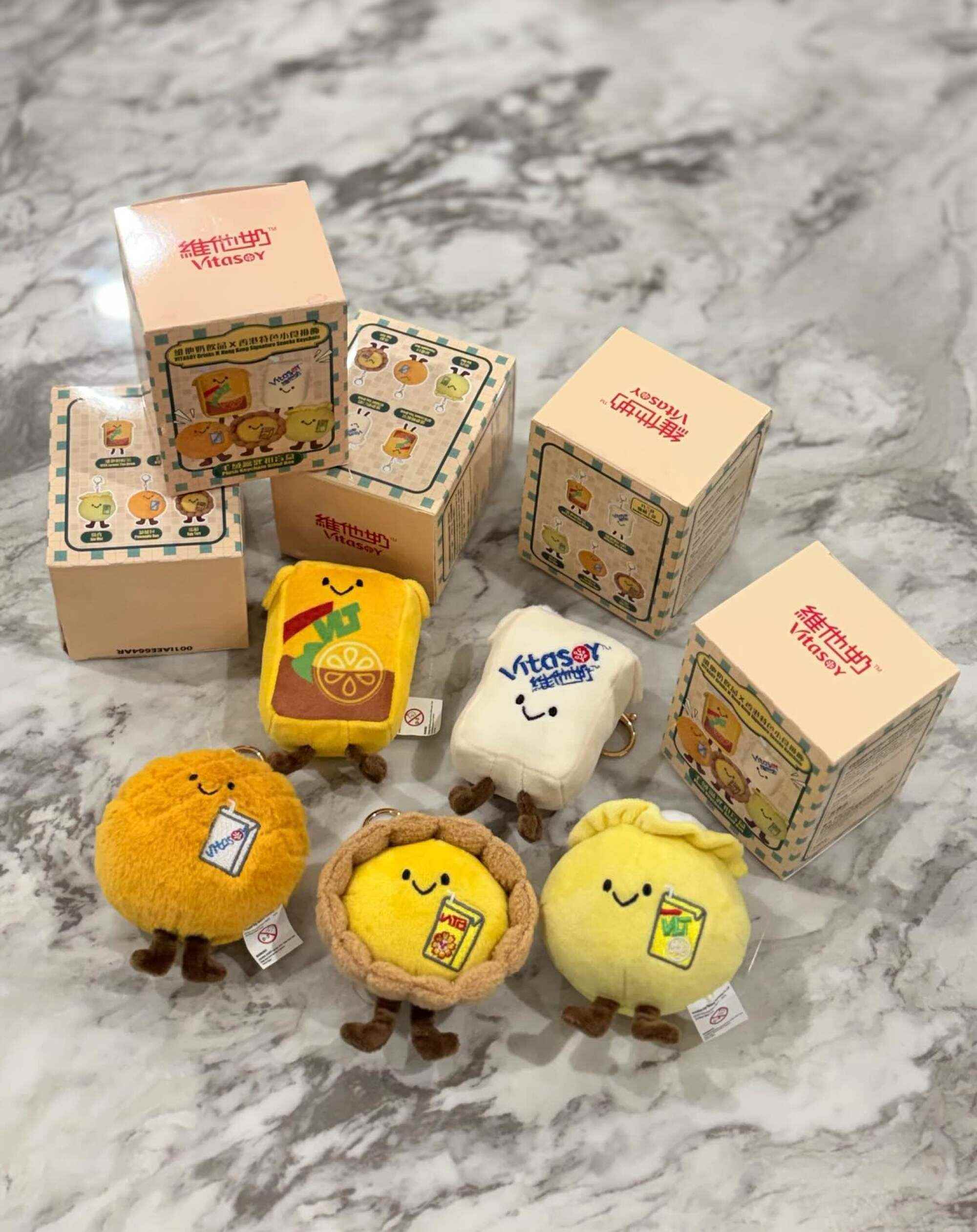 Vitasoy plushies featuring everyday Hong Kong food and drink items, from lemon tea to egg tarts and siu mai. Photo: Instagram/@ettason.au