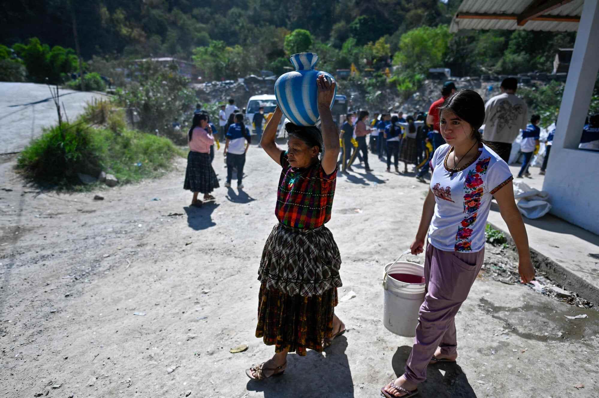 Indigenous women carry containers of drinking water during a clean-up of the Las Vacas river in Santa Cruz village, Chinautla, Guatemala, on March 20, 2026, ahead of the celebration of World Water Day on March 22. Photo: AFP