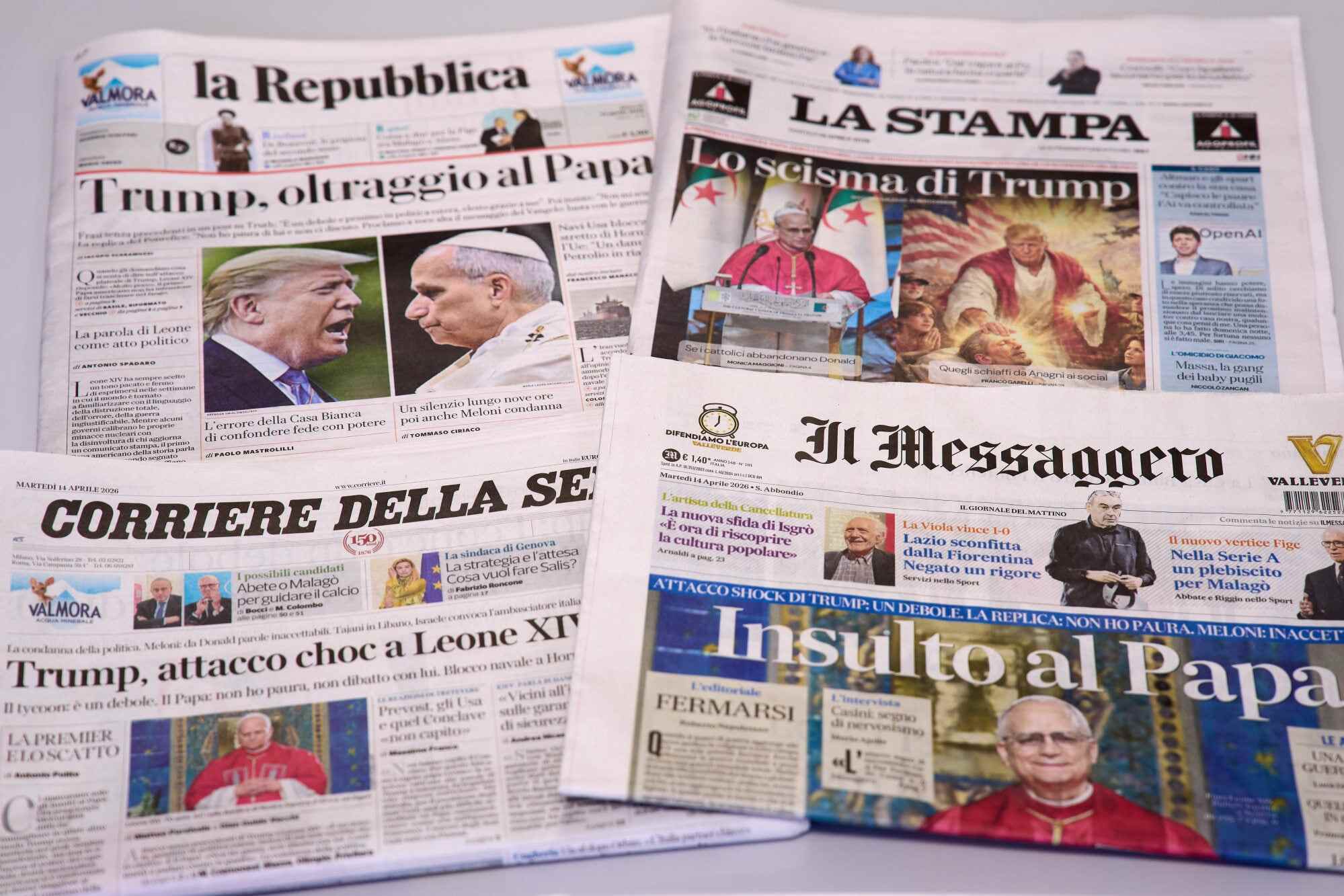 The front pages of Italian newspapers reporting on comments by US President Donald Trump about Pope Leo XIV, with headlines using words such as “outrage”, “shock attack” and “insult”. Photo: AP