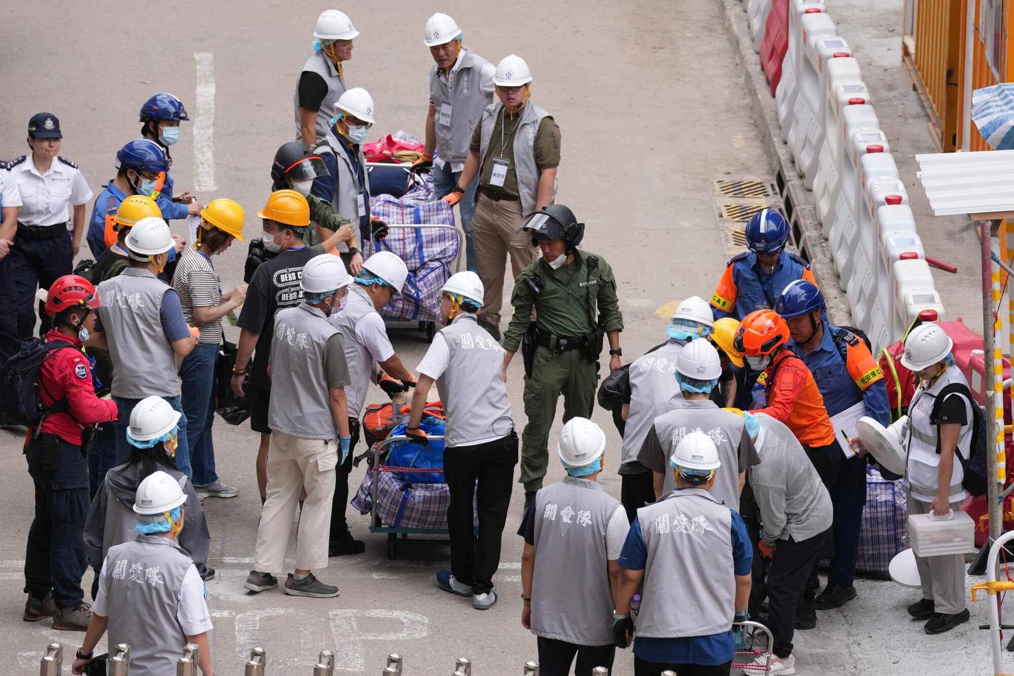 Residents were seen carrying suitcases, backpacks and large cardboard boxes, hoping to collect valuables and cherished items. Photo: Karma Lo