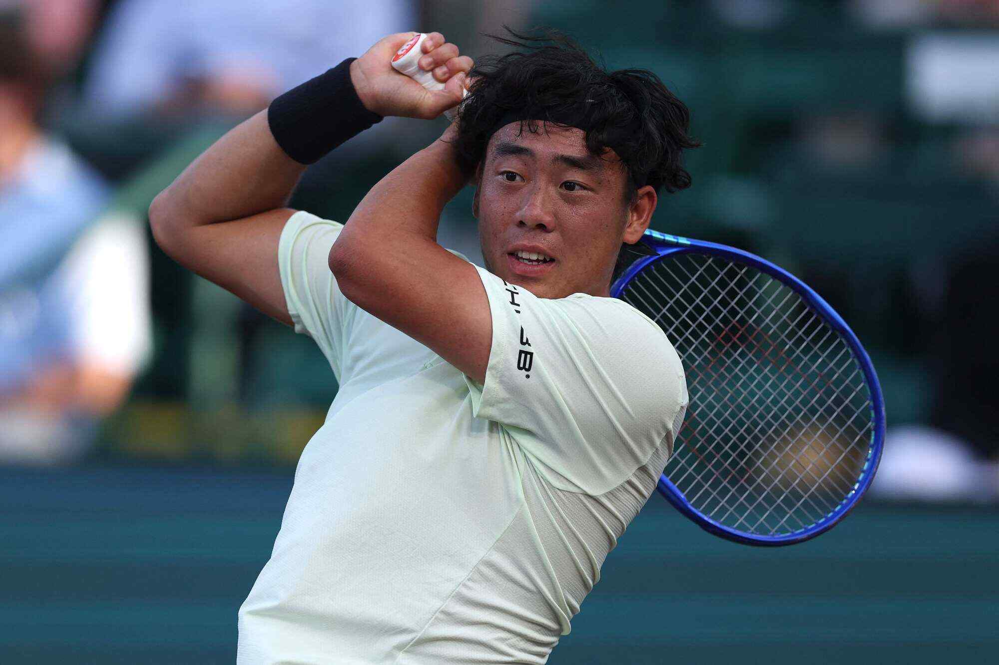 Athena looks up to Hong Kong tennis player Coleman Wong, seen here returning a shot against Alex Michelson of the United States during the Singles match at the Fayez Sarofim & Co US Men’s Clay Court Championship in Houston, Texas. Photo: AFP