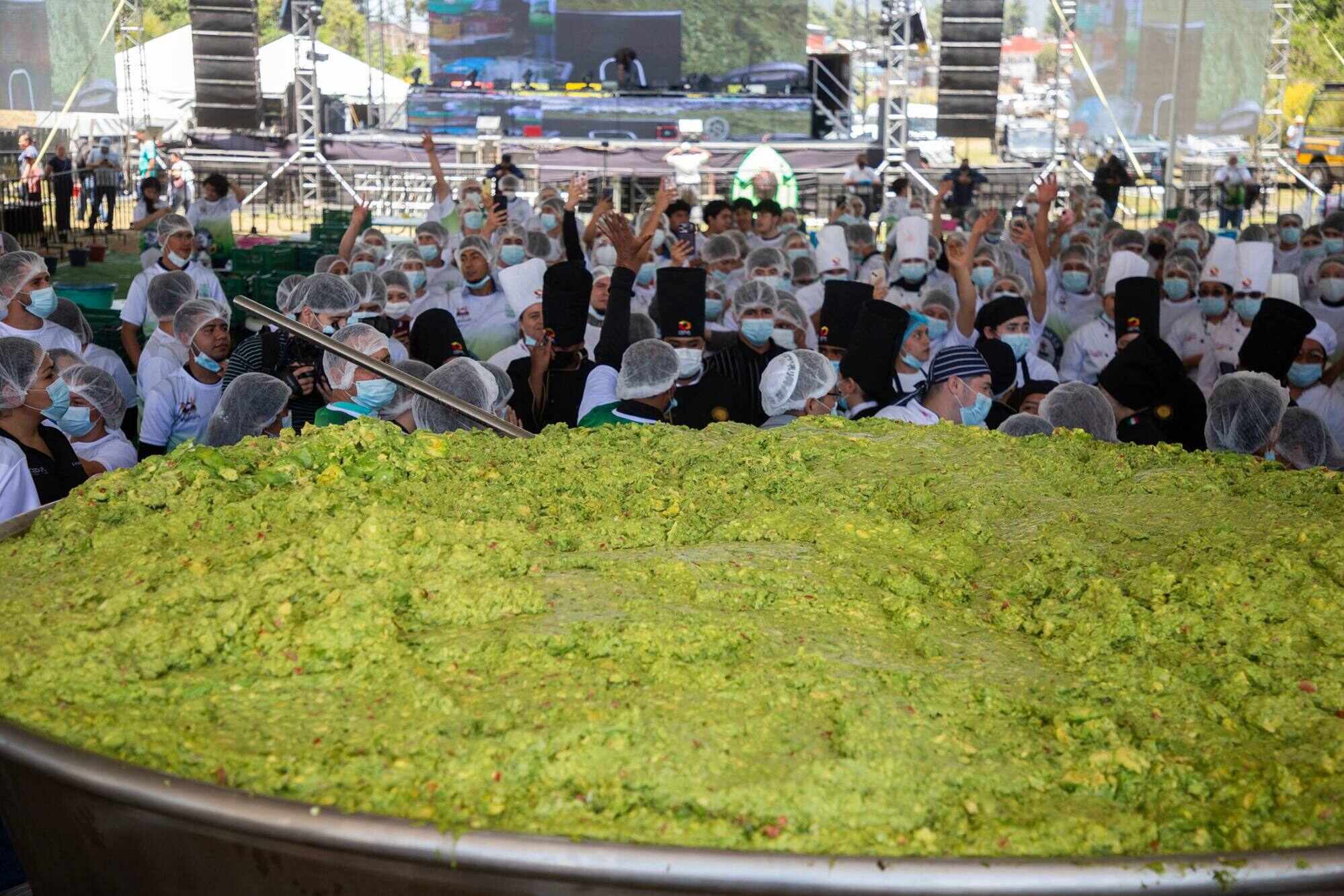 Participants prepare 6,800kg of guacamole, a traditional Mexican dish made from avocados, tomatoes, onions, limes and coriander in Tancitaro, Michoacan state, Mexico on April 10, 2026. There were 800 people who completed the task in an attempt to break the Guinness World Record for the largest guacamole. Tancitaro is recognised as the “Avocado Capital” and the leading exporter of avocados to the United States. Photo: AFP
