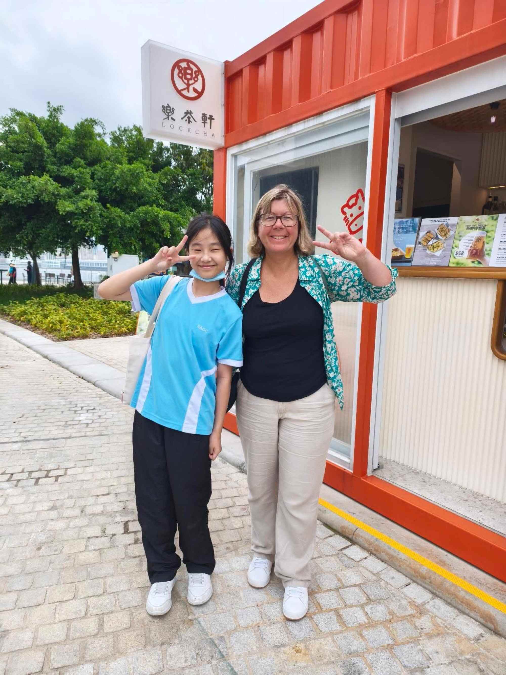 Snowy Shiu poses with someone while playing a game with her classmates at West Kowloon. Photo: Handout
