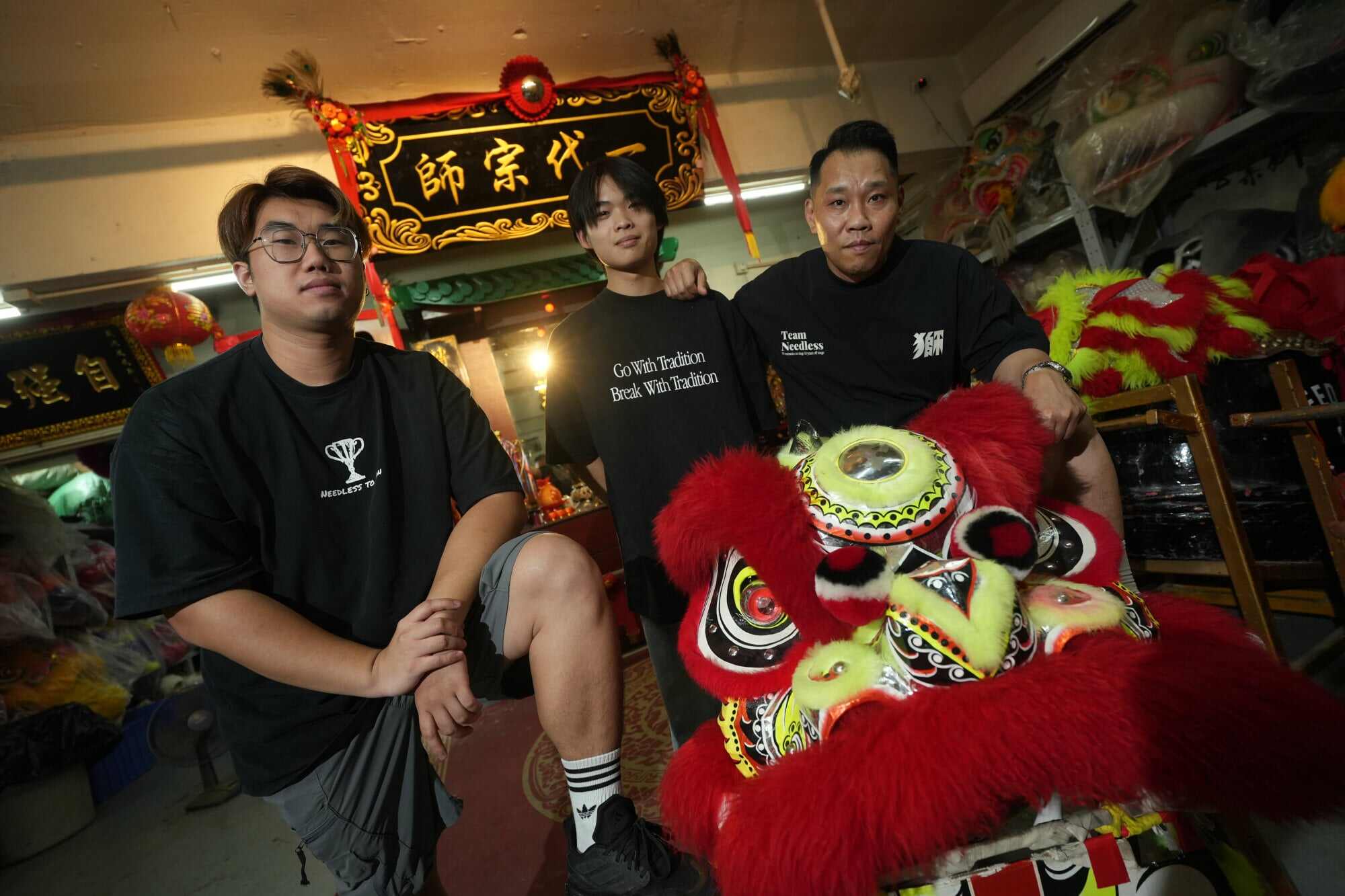 From left, lion dance athletes John Siu, 23, and Jay Keung, 20, with their head coach and Jay’s father, Keung Wai-hong (right). Photos: Sun Yeung