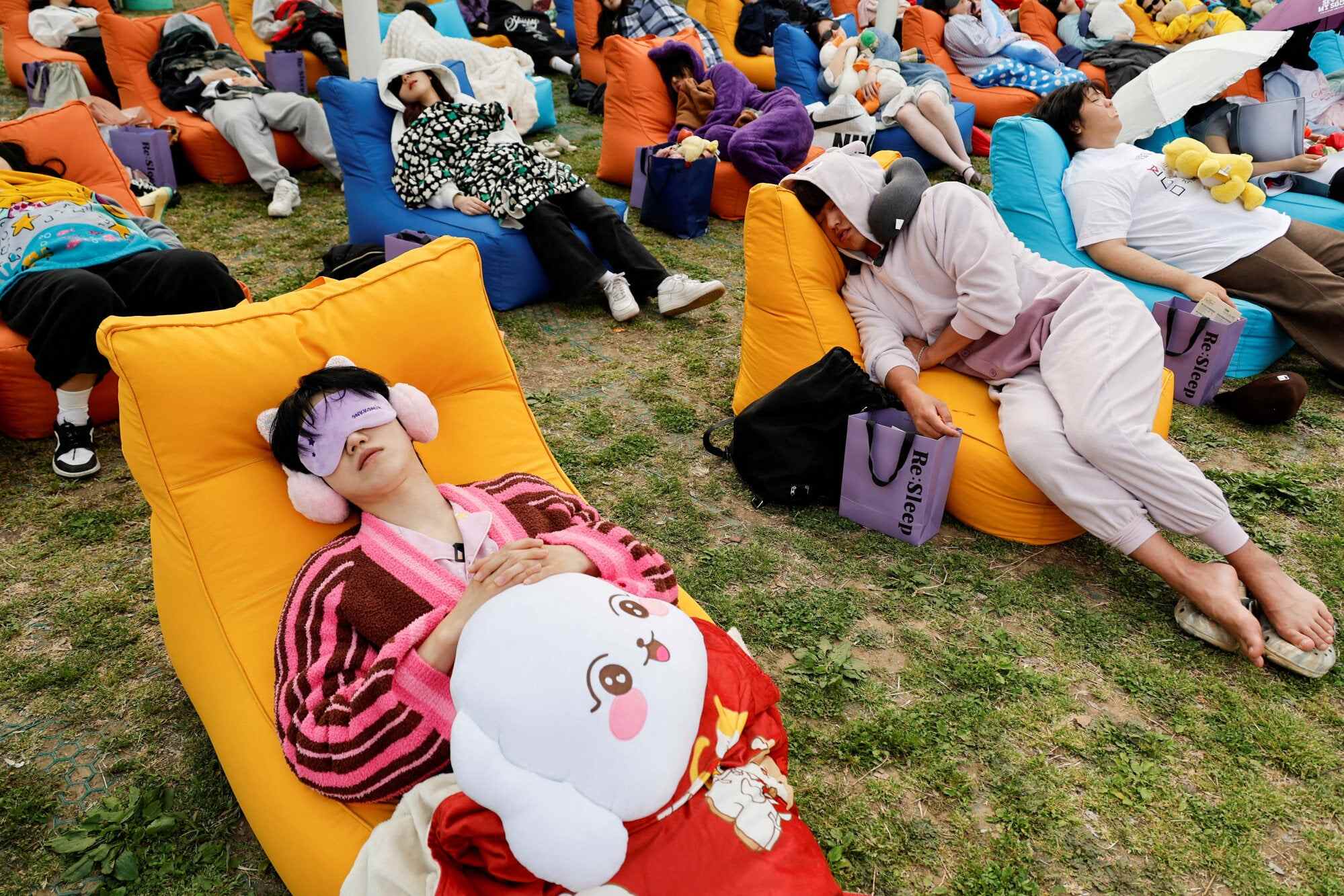Participants sleep during the 2026 Power Nap contest at Han River Park in Seoul, South Korea. Photo: Reuters