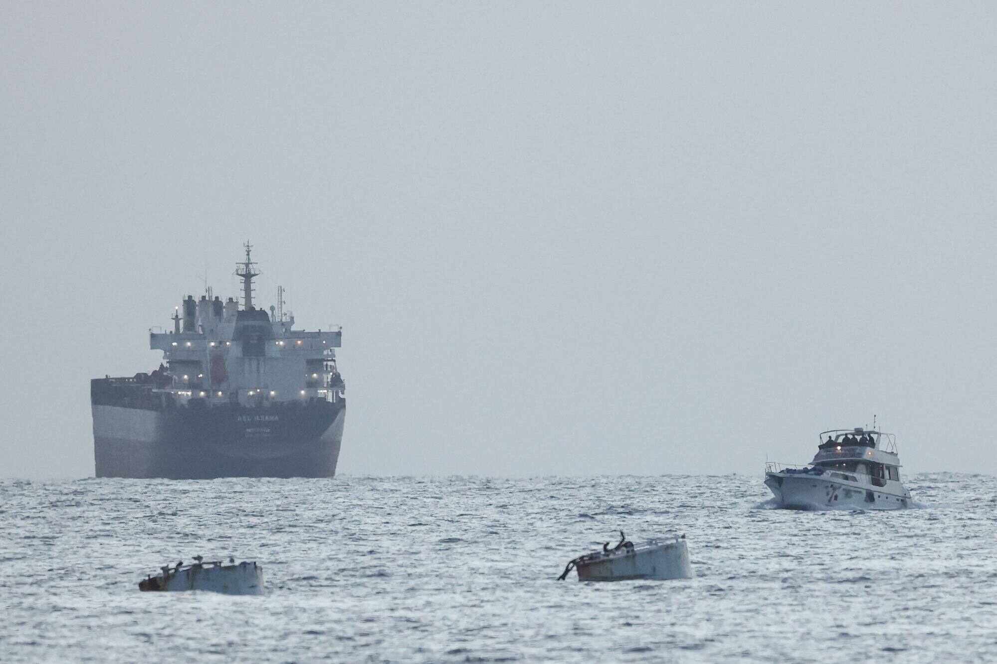 A boat bearing symbols of one of the vessels in the Gaza-bound aid flotilla (left) that was intercepted by the Israeli navy, is motored towards the Israeli port of Ashdod, about 40km south of Tel Aviv, on May 19. Photo: AFP