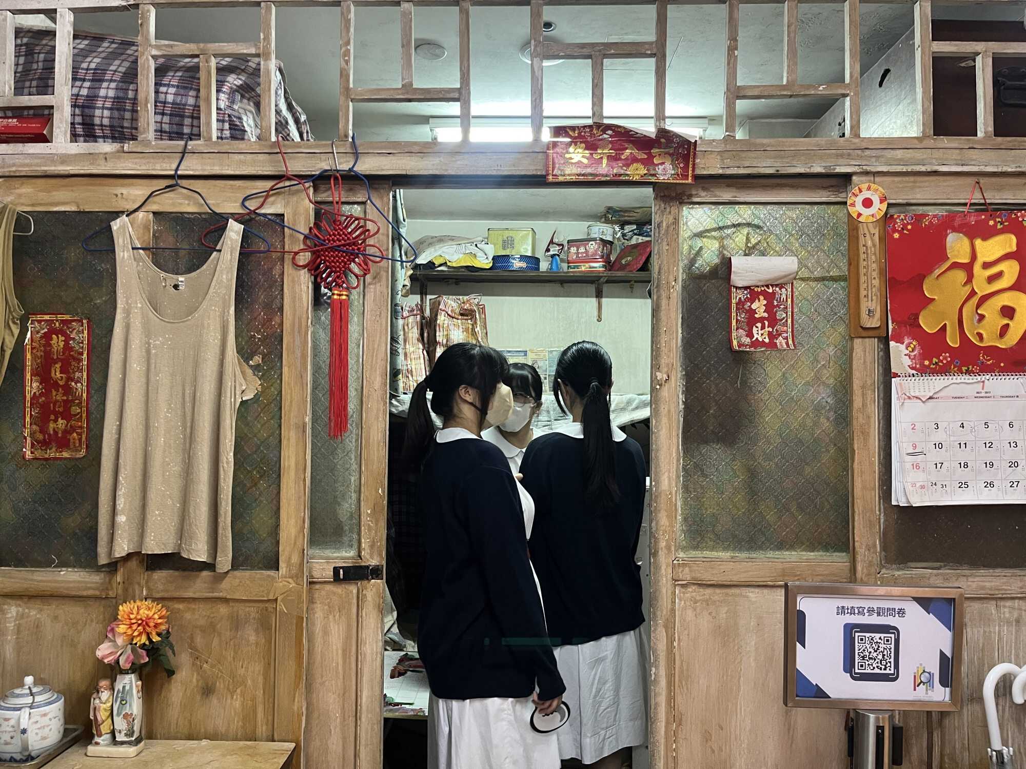 Visitors can step into an experiential exhibit to learn more about the challenges of people living in Hong Kong’s cramped subdivided flats. Photo: Kelly Fung