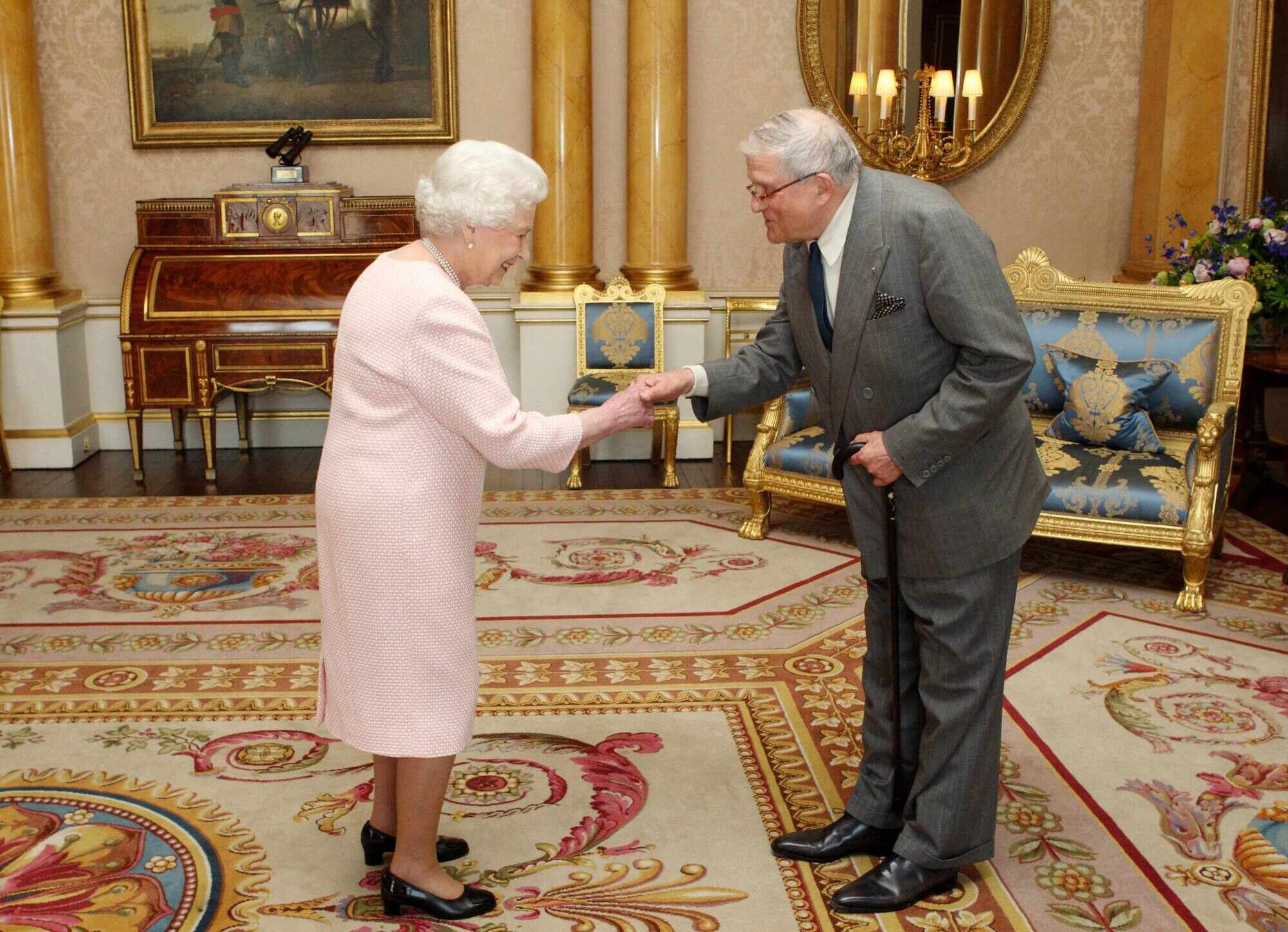 Britain’s Queen Elizabeth presents Hockney with the Order of Merit at Buckingham Palace in London in 2012. Photo: AFP