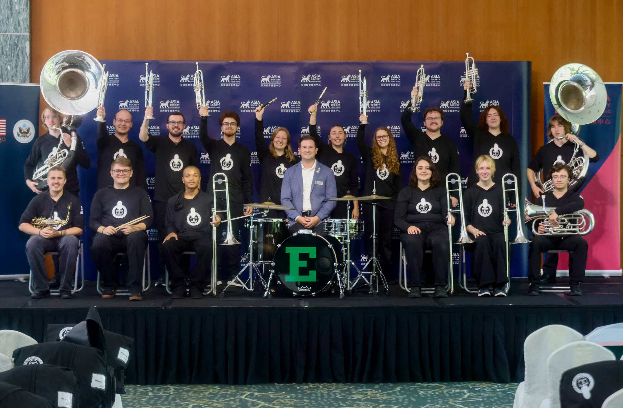 Nick Smith (centre), associate director of bands for the School of Music and Dance at Eastern Michigan University, poses with members of the marching band and the university’s mascot at Asia Society Hong Kong. Photo: Jonathan Wong