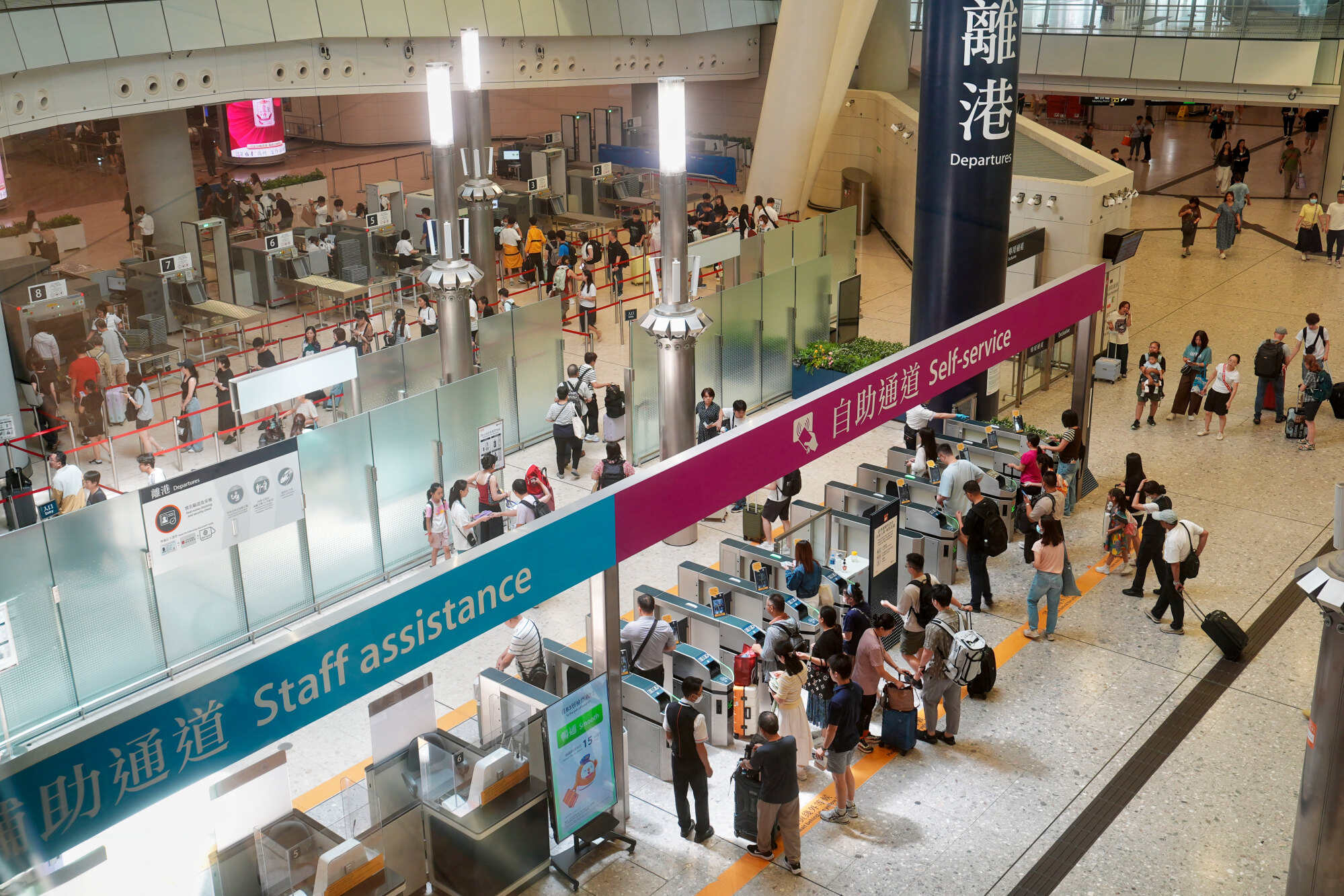 Travellers at the departure hall of West Kowloon terminus on July 1. Photo: Elson Li
