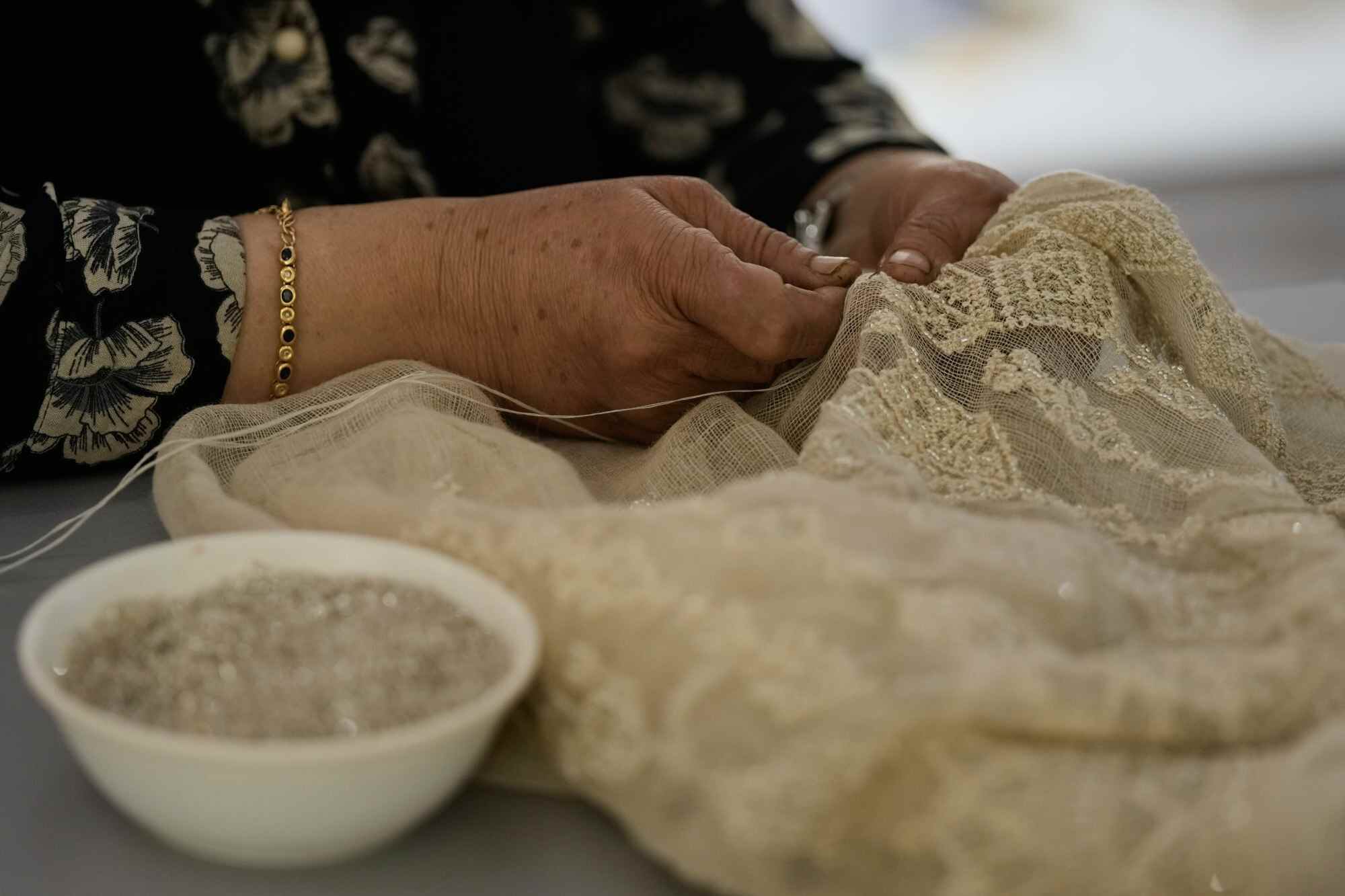 Palestinian weaver Samira Nasser works on a handmade embroidered piece. Photo: AP