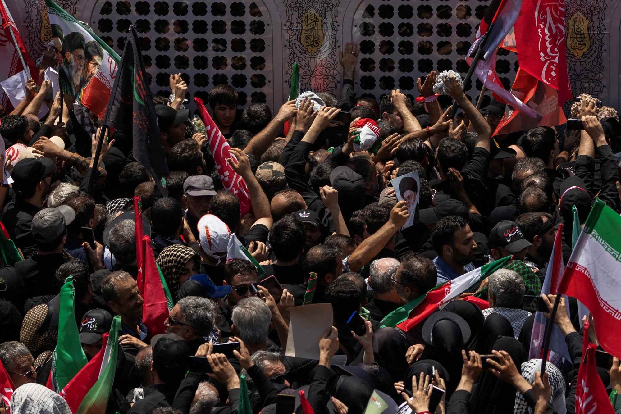 Mourners crowd next to the vehicle carrying the coffins of Iran’s late Supreme Leader Ayatollah Ali Khamenei and members of his family. Photo: Reuters