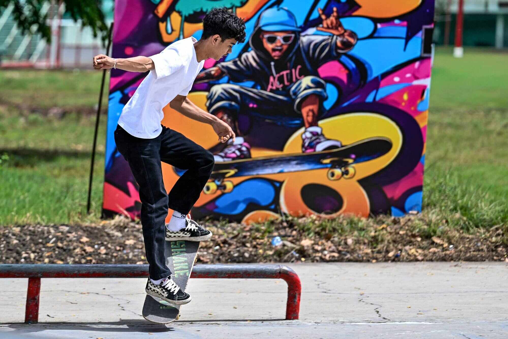 A skateboarder performs a trick at a skatepark on Go Skateboarding Day in Banda Aceh, Indonesia. Photo: AFP
