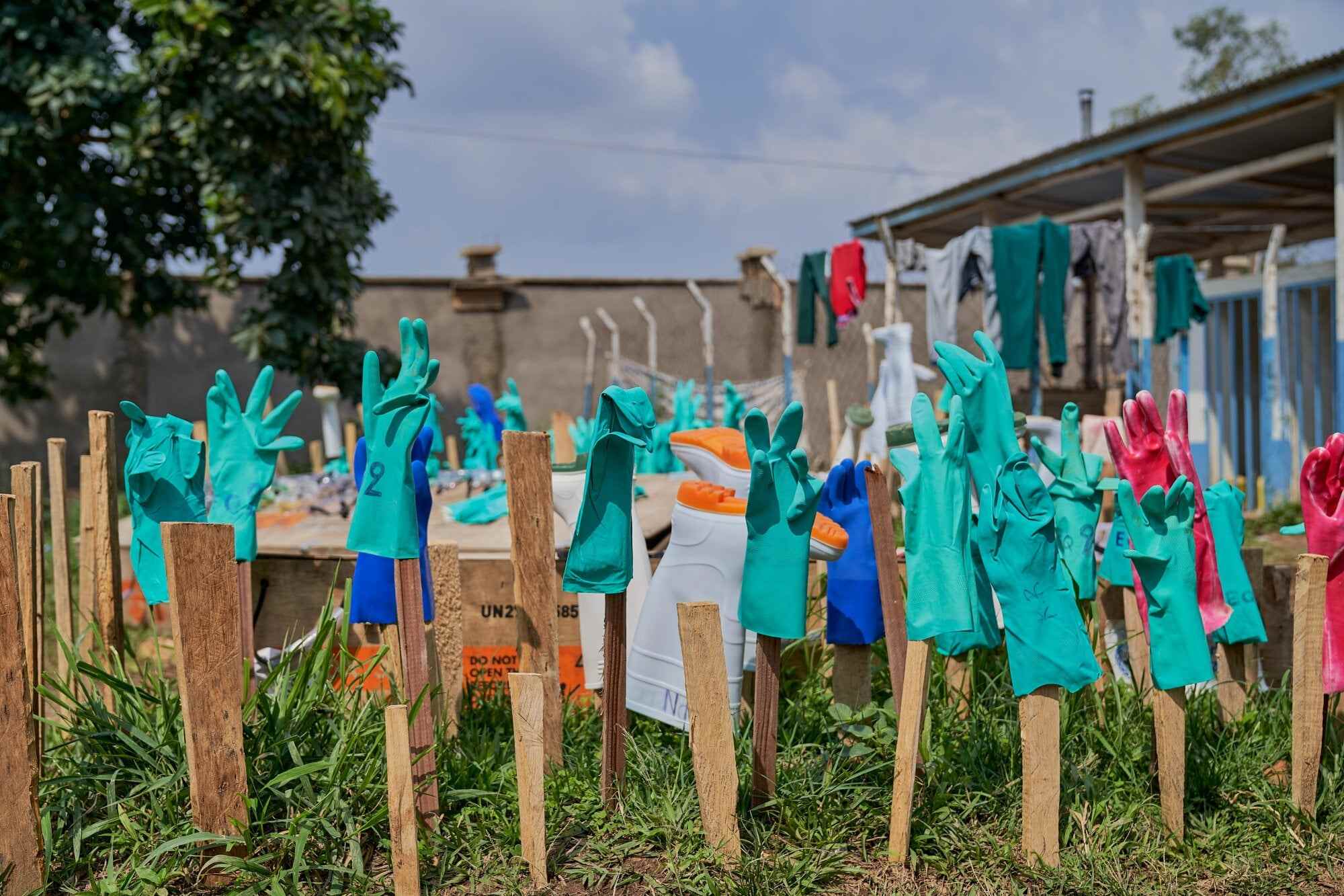 Rubber gloves dry in the sun at the Ebola treatment centre of the General Hospital in Bunia, Ituri province, Democratic Republic of Congo. Attacks on health facilities and response teams have also forced frontline workers and aid groups out of some areas. Photo: EPA