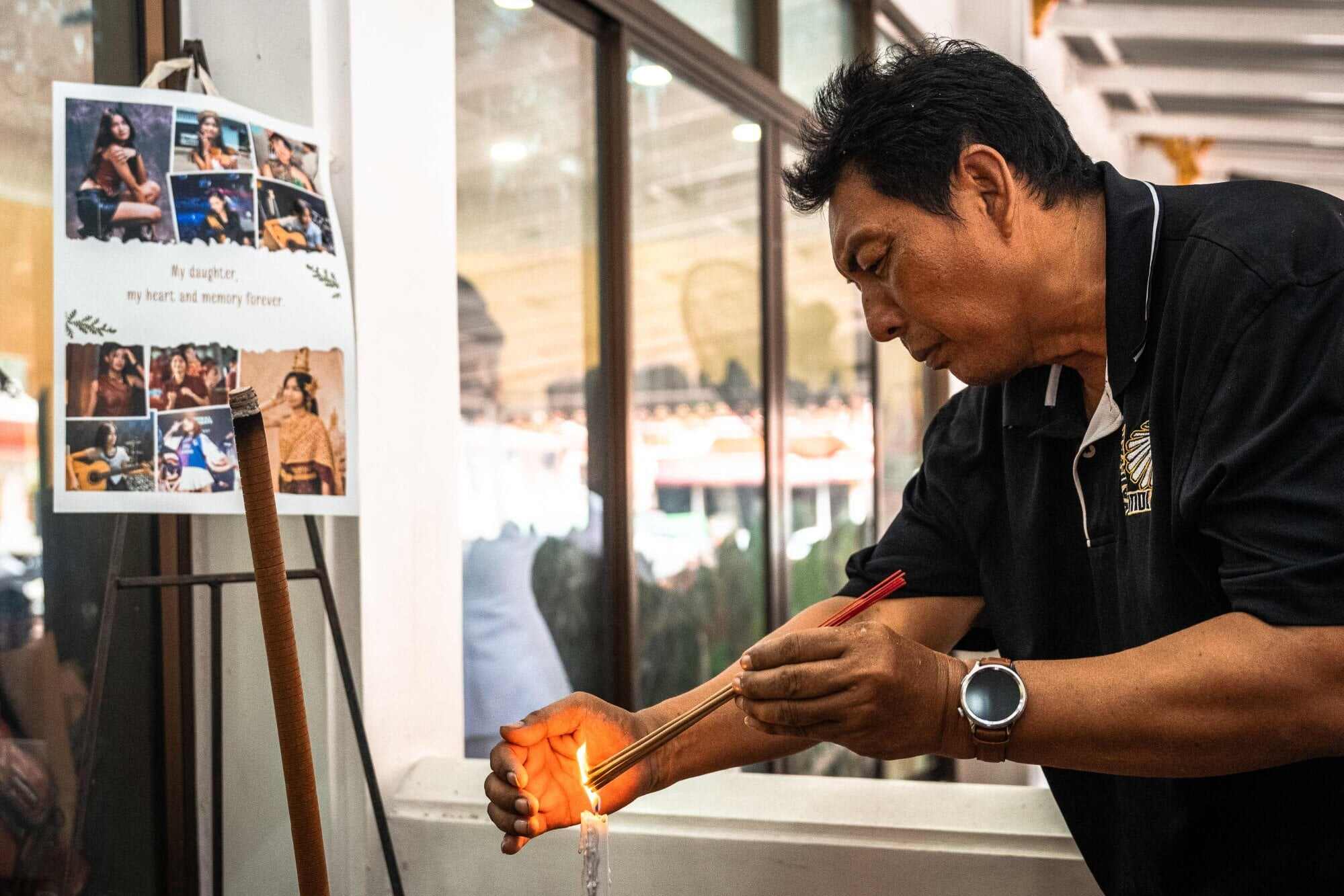 A mourner prays for 12-year-old school shooting victim Naphat Chaima during her funeral on August 9, 2026. Photo: AFP