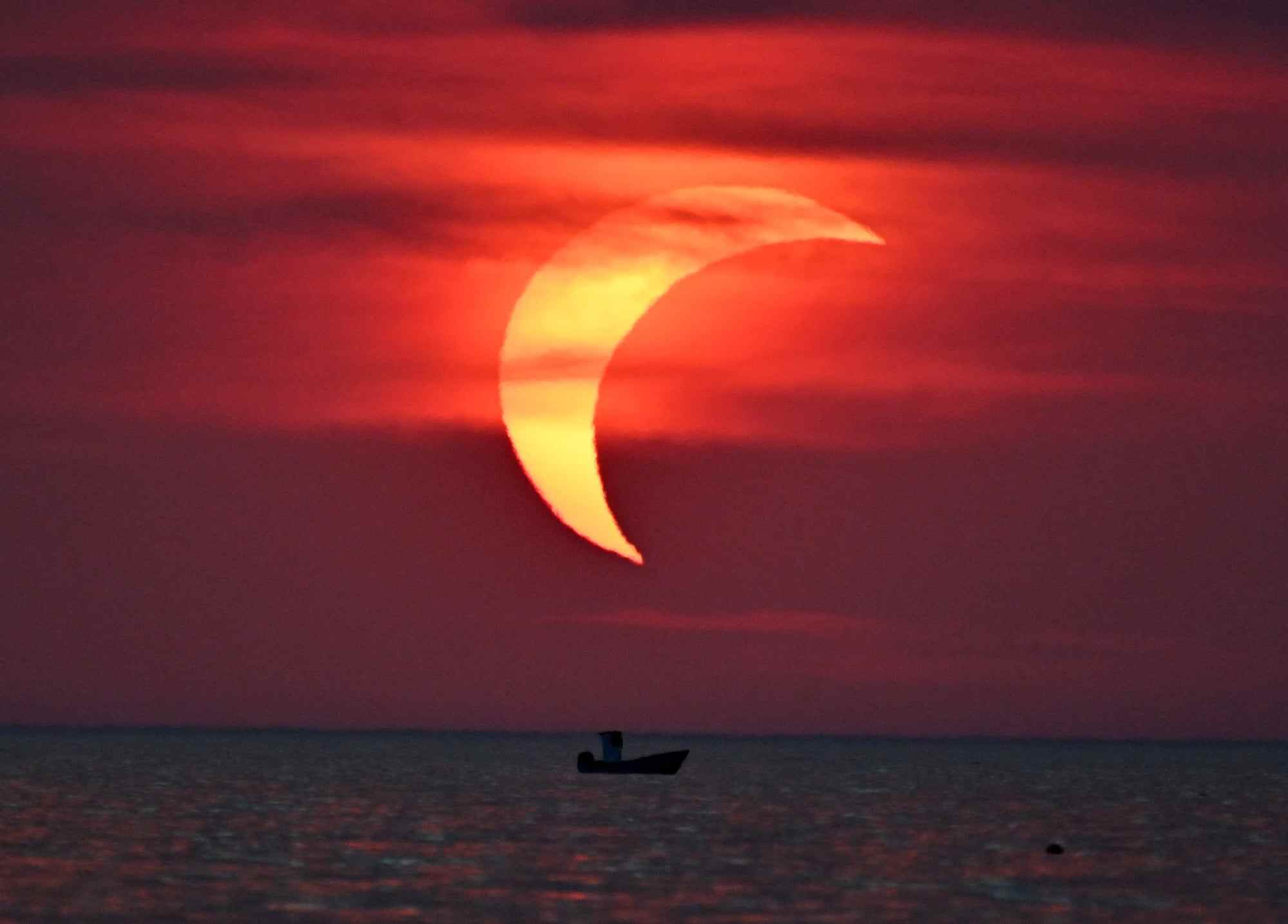 A partial solar eclipse over the sea in Ladispoli, Italy. Photo: Xinhua