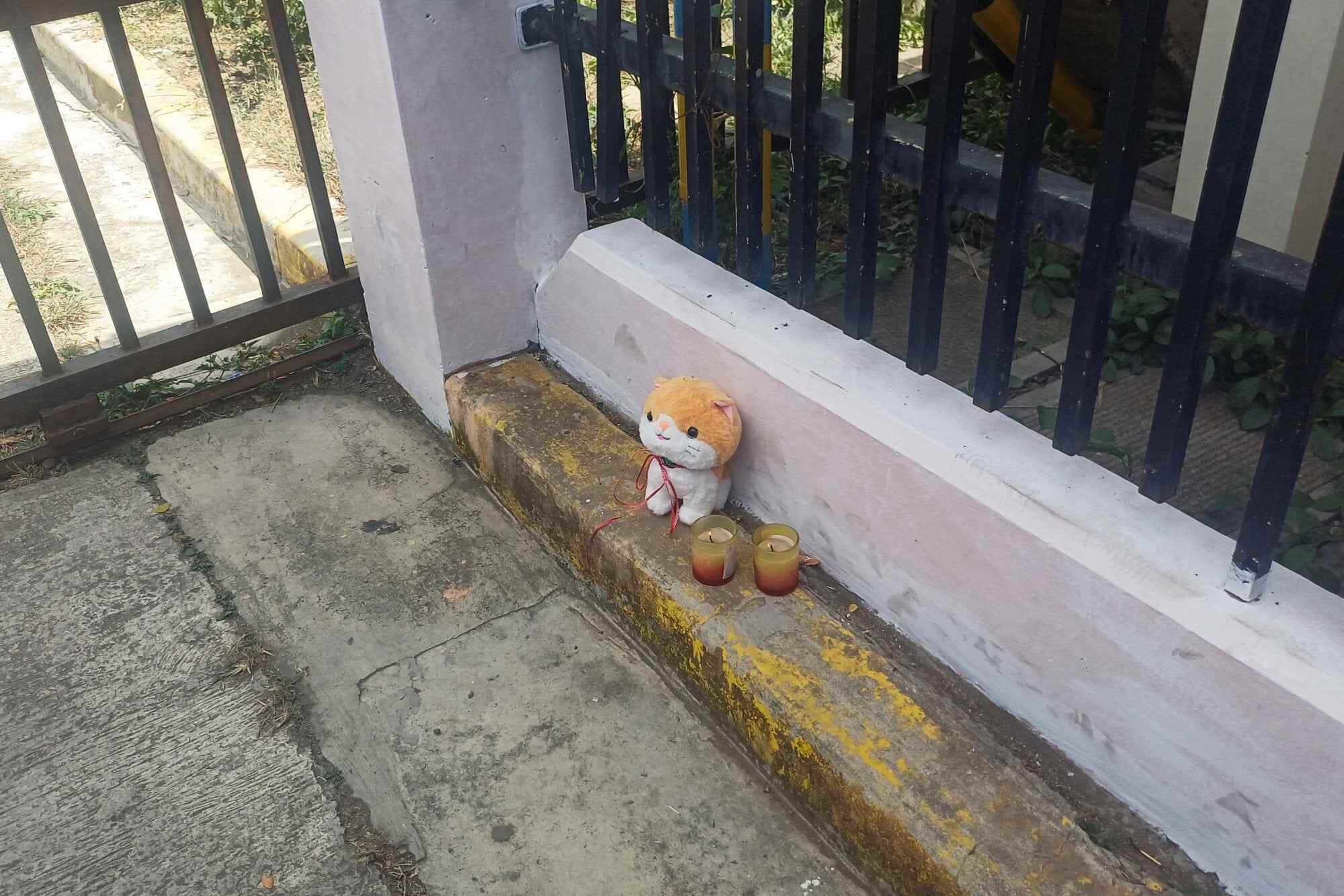 Candles and a stuffed toy left outside Ateneo de Zamboanga University after a shooting that killed two people in Zamboanga, southern Philippines. Photo: Reuters