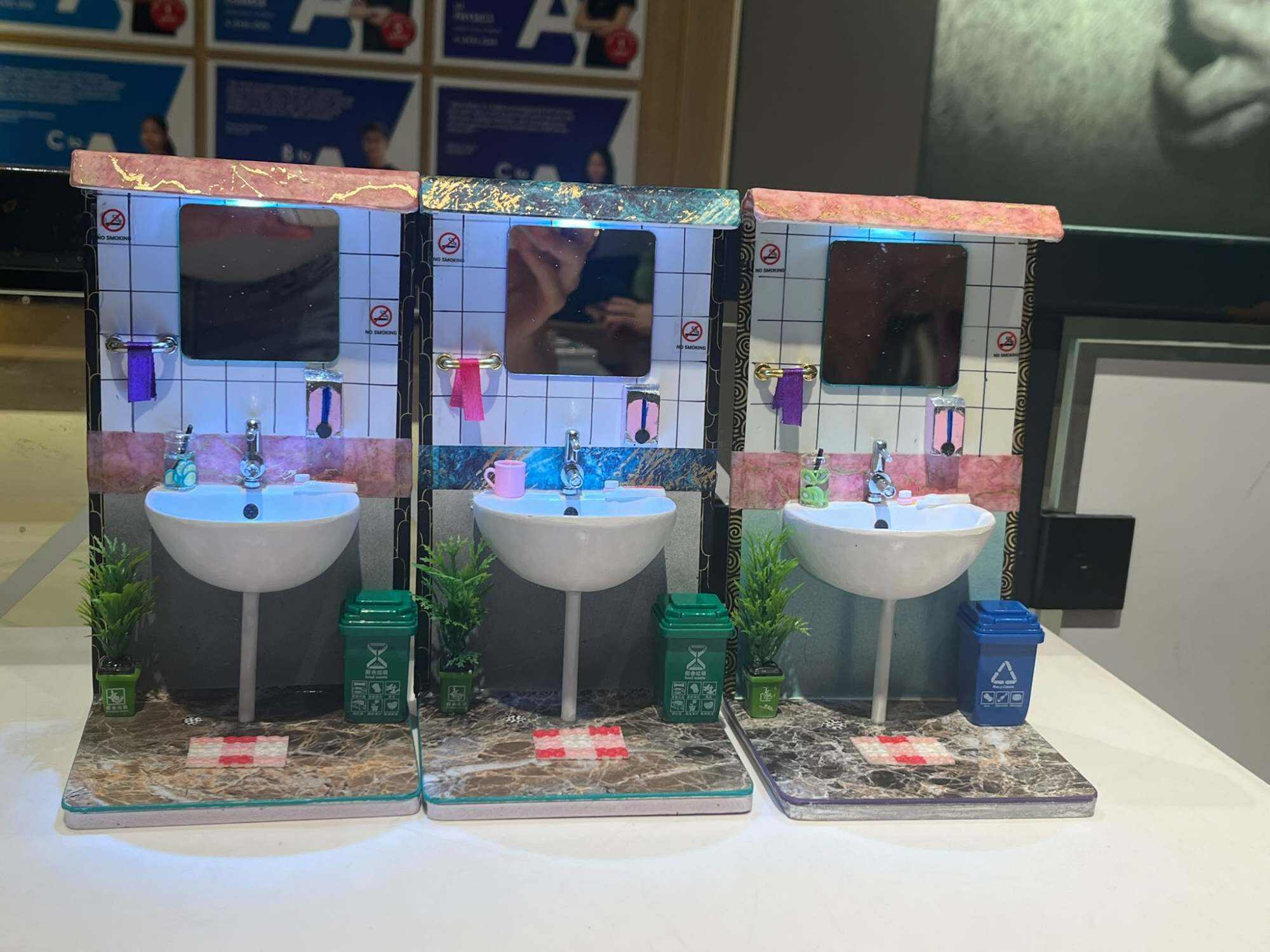 Each miniature bathroom model takes about six days to build, with the sink basin needing the most time. Photo: Doris Wai